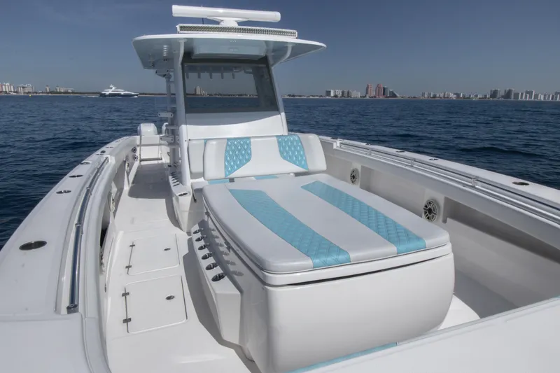 Slide: The Image of 2019 Invincible 40 Catamaran on open water, featuring spacious deck and modern design. - 24