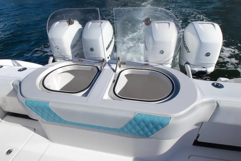 Slide: The Image of 2019 Invincible 40 Catamaran with dual Mercury outboard engines and livewell compartments. - 7