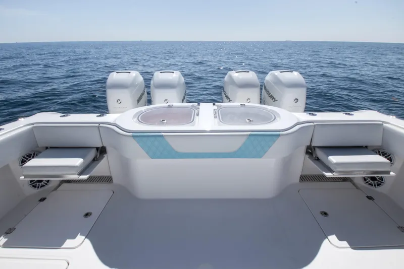 Slide: The Image of 2019 Invincible 40 Catamaran with quad engines, spacious deck, and ocean view. - 8