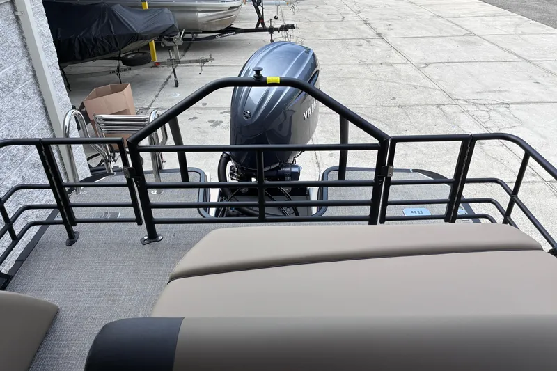 Slide: The Image of Rear view of a 2026 Starcraft EXS 1 Q DH boat with outboard motor. - 11