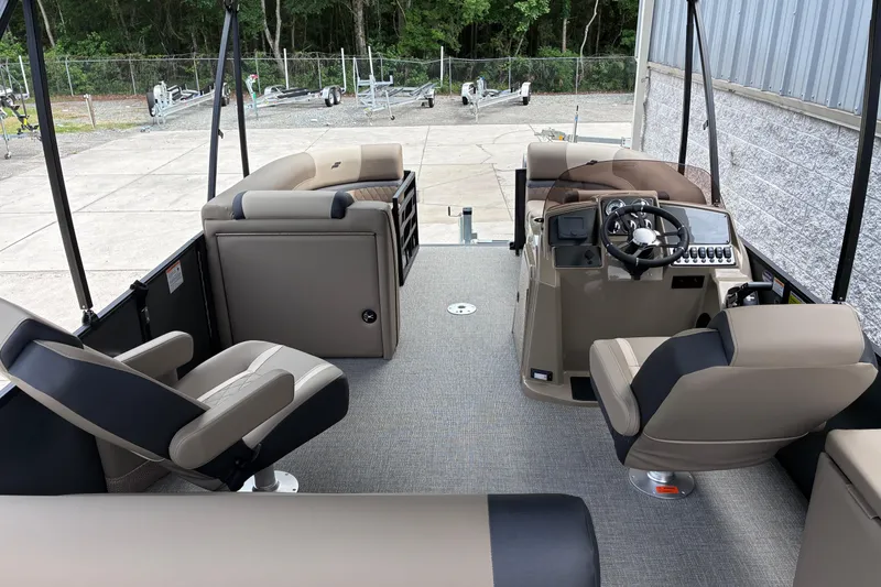 Slide: The Image of Interior of 2026 Starcraft EXS 1 Q DH boat with modern seating and steering console. - 13