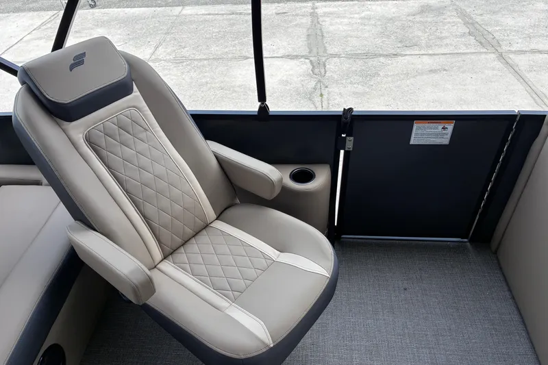 Slide: The Image of Luxurious seating in the 2026 Starcraft EXS 1 Q DH boat, featuring quilted upholstery. - 15