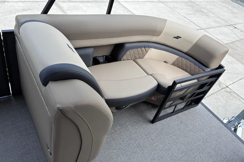 Slide: The Image of Luxurious seating on 2026 Starcraft EXS 1 Q DH boat, featuring elegant beige upholstery. - 16