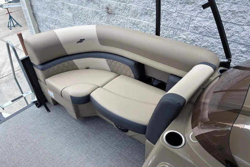 Slide: The Image of Luxurious seating on 2026 Starcraft EXS 1 Q DH boat, featuring beige and black upholstery. - 17