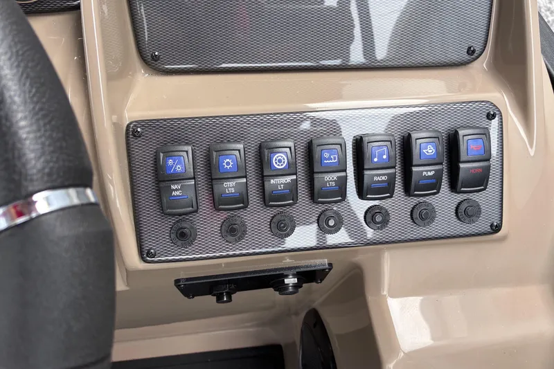 Slide: The Image of Control panel of 2026 Starcraft EXS 1 Q DH boat with labeled switches. - 19