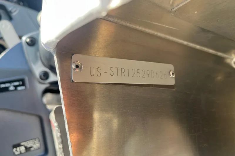 Slide: The Image of Metallic identification plate on 2026 Starcraft EXS 1 Q DH boat. - 24
