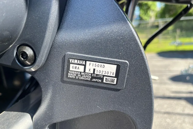 Slide: The Image of Close-up of Yamaha F150XD engine label on Starcraft EXS 1 Q DH, 2026 model. - 25