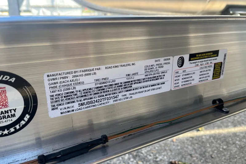 Slide: The Image of Label on Starcraft EXS 1 Q DH trailer, 2026 model, detailing specifications and safety standards. - 26