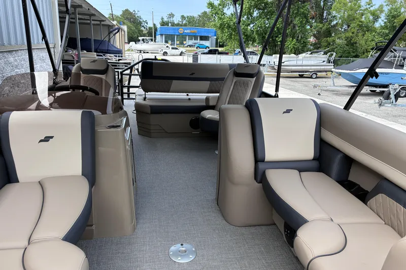 Slide: The Image of Interior of 2026 Starcraft EXS 1 Q DH boat with beige and gray seating. - 9