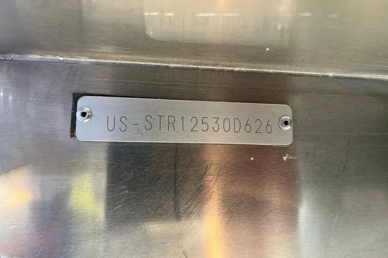 Slide: The Image of Metallic identification plate on Starcraft EXS 3 FD, 2026 model, with serial number. - 10