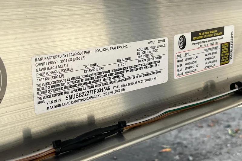 Slide: The Image of Label on a 2026 Starcraft EXS 3 FD trailer detailing specifications and safety standards. - 12