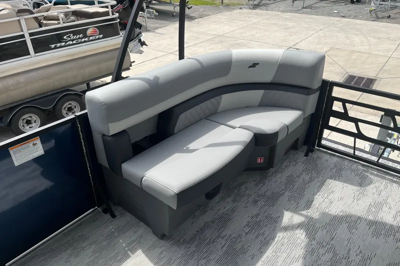 Slide: The Image of 2026 Starcraft EXS 3 FD pontoon boat with gray seating on deck. - 14