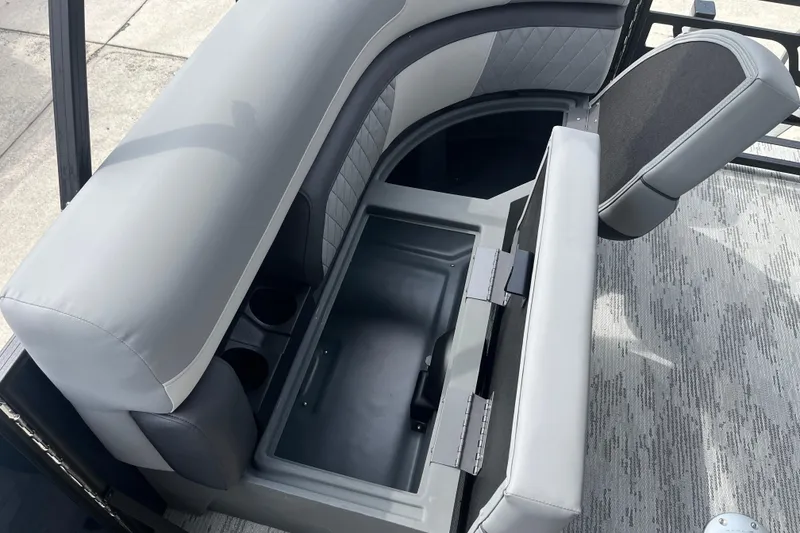 Slide: The Image of Starcraft EXS 3 FD 2026 boat seat with storage compartment open. - 15