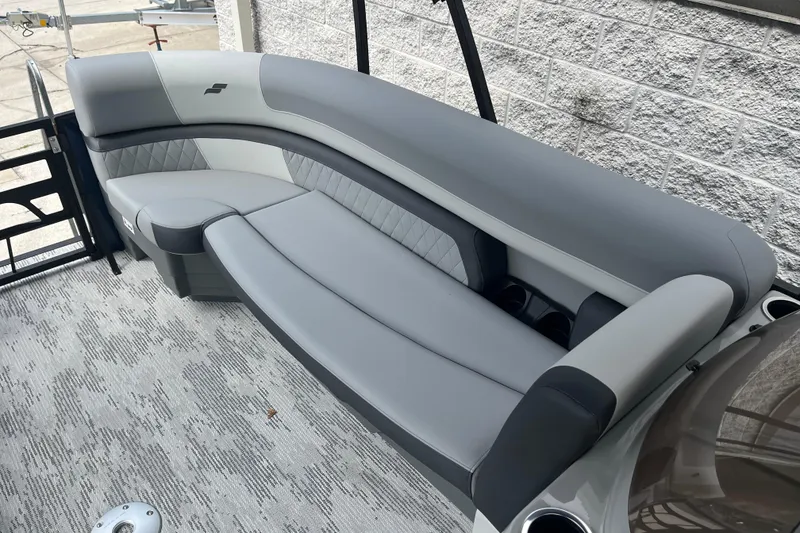 Slide: The Image of Luxurious seating on 2026 Starcraft EXS 3 FD boat, featuring modern gray upholstery. - 16