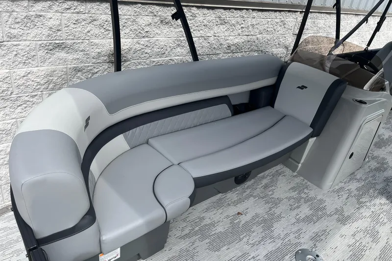 Slide: The Image of 2026 Starcraft EXS 3 FD boat interior with sleek gray seating and modern design. - 17