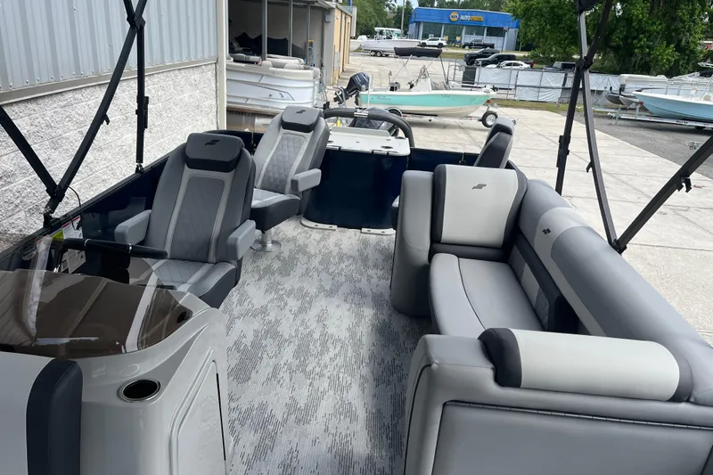 Slide: The Image of 2026 Starcraft EXS 3 FD boat interior with modern seating and sleek design. - 19