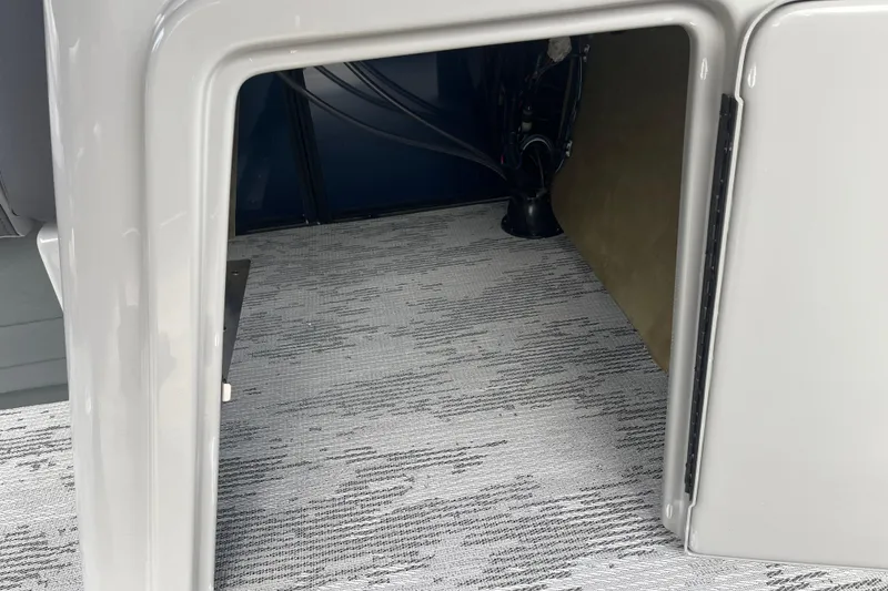 Slide: The Image of Interior view of 2026 Starcraft EXS 3 FD boat compartment with carpeted flooring. - 21