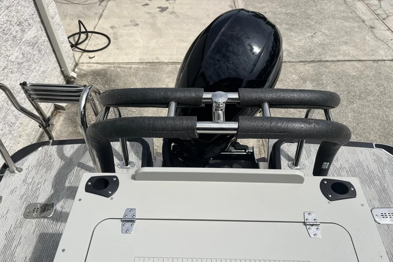 Slide: The Image of 2026 Starcraft EXS 3 FD boat stern with motor and ladder, viewed from above. - 29