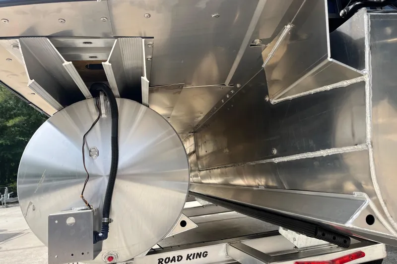 Slide: The Image of 2026 Starcraft EXS 3 FD boat underside, showcasing aluminum construction and wiring details. - 36