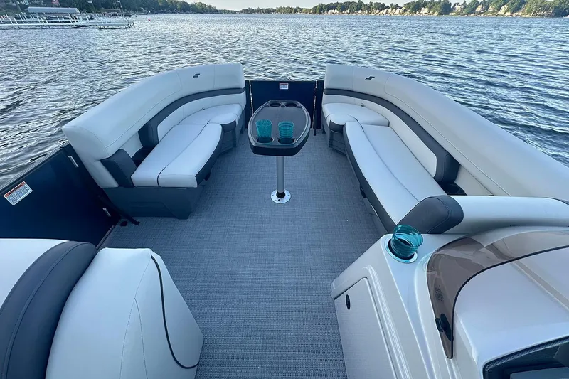 Slide: The Image of Manufacturer Provided Image: Luxurious 2026 Starcraft EXS 3 FD boat interior with plush seating and scenic lake view. - 4