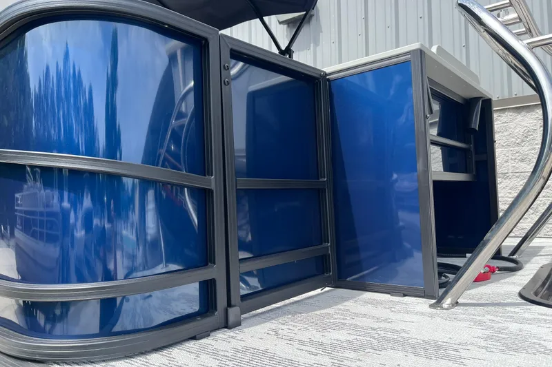 Slide: The Image of 2026 Starcraft EXS 3 FD pontoon boat with sleek blue panels and modern design. - 41