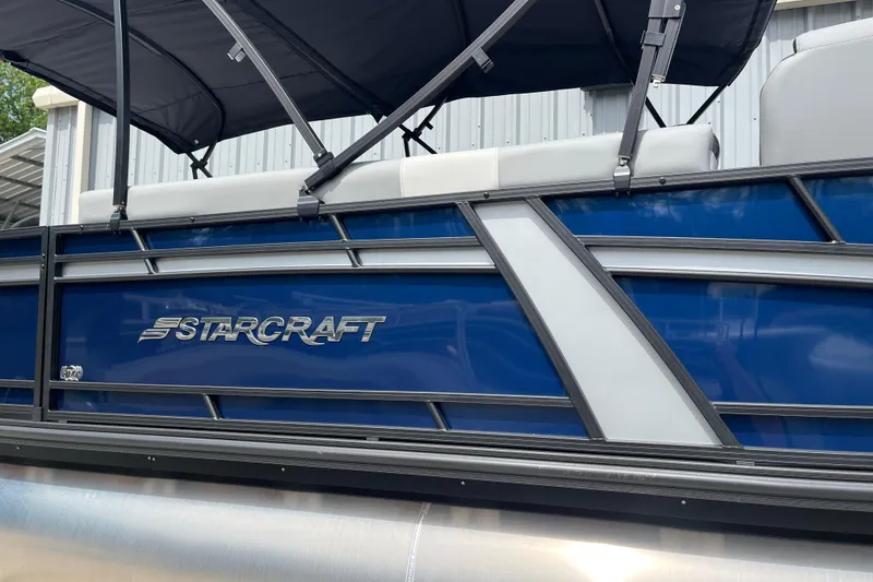 Slide: The Image of 2026 Starcraft EXS 3 FD pontoon boat with blue and silver exterior detailing. - 42