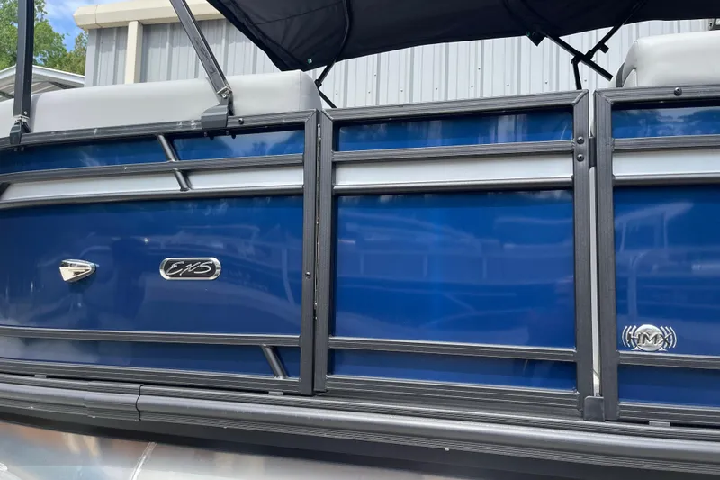 Slide: The Image of 2026 Starcraft EXS 3 FD boat with sleek blue exterior and modern design. - 44