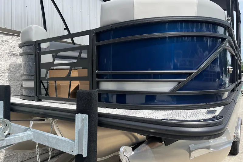 Slide: The Image of 2026 Starcraft EXS 3 FD pontoon boat with sleek blue exterior and modern design. - 46