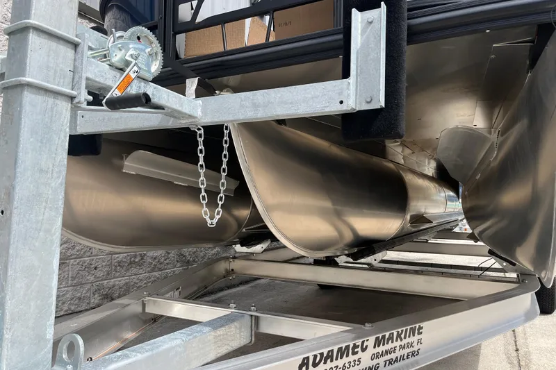 Slide: The Image of 2026 Starcraft EXS 3 FD pontoon boat on trailer, showcasing sleek aluminum pontoons. - 47