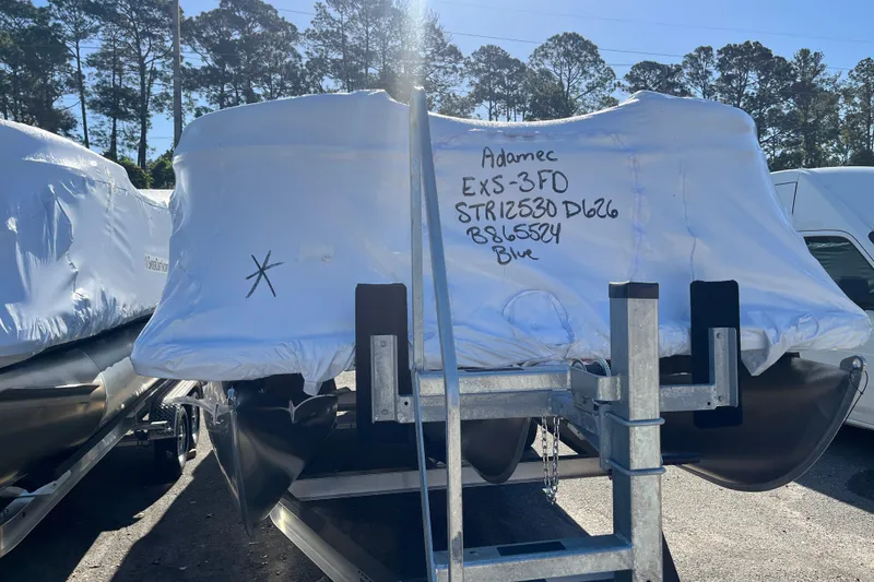 Slide: The Image of Covered Starcraft EXS 3 FD boat, 2026 model, on trailer. - 49