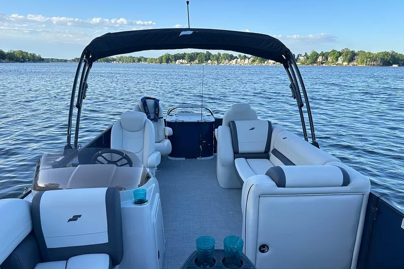 Slide: The Image of Manufacturer Provided Image: 2026 Starcraft EXS 3 FD boat interior on a serene lake. - 5