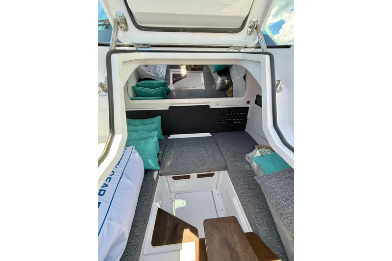 Slide: The Image of Interior cabin of 2025 Axopar 29 Sun-Top boat with cushions and seating. - 20