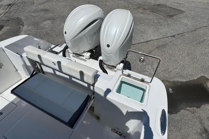 Slide: The Image of 2026 Edgewater 262CC boat with dual Yamaha engines and seating area. - 10