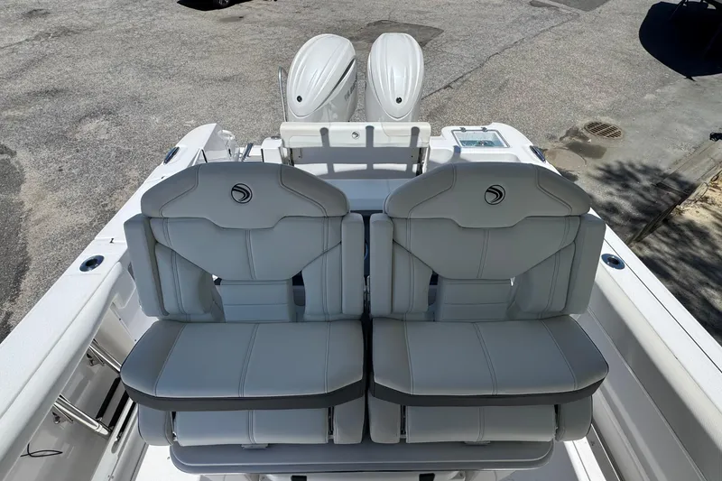 Slide: The Image of 2026 Edgewater 262CC boat with dual engines and comfortable seating, viewed from above. - 11