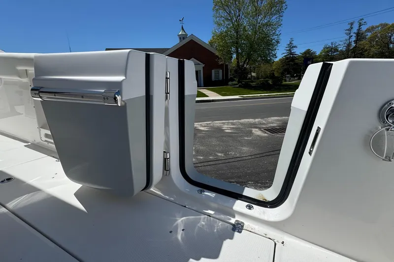 Slide: The Image of 2026 Edgewater 262CC boat with open side door, showcasing sleek design and functionality. - 13