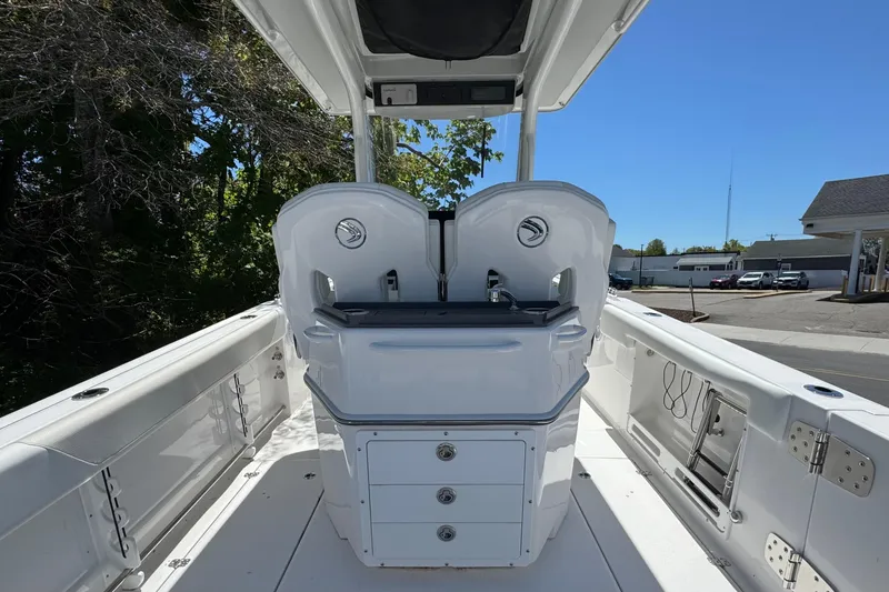 Slide: The Image of 2026 Edgewater 262CC boat interior with dual seats and storage compartments. - 17