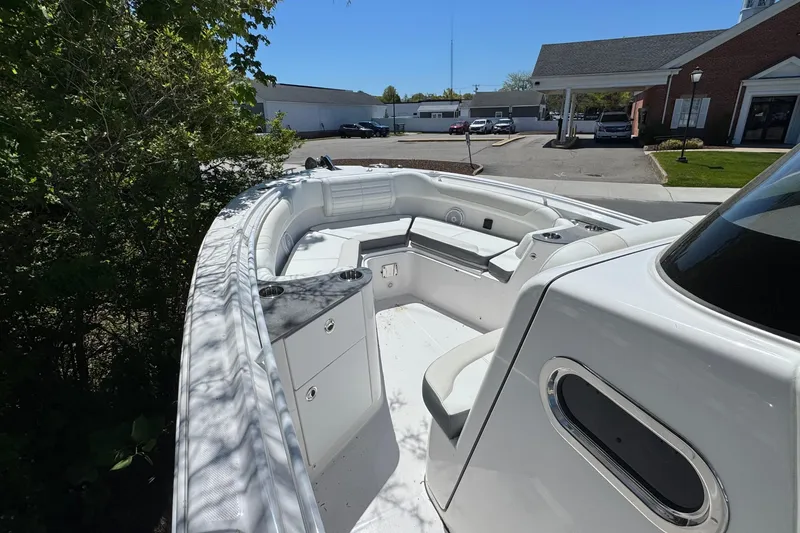 Slide: The Image of 2026 Edgewater 262CC boat interior with seating and storage compartments. - 27