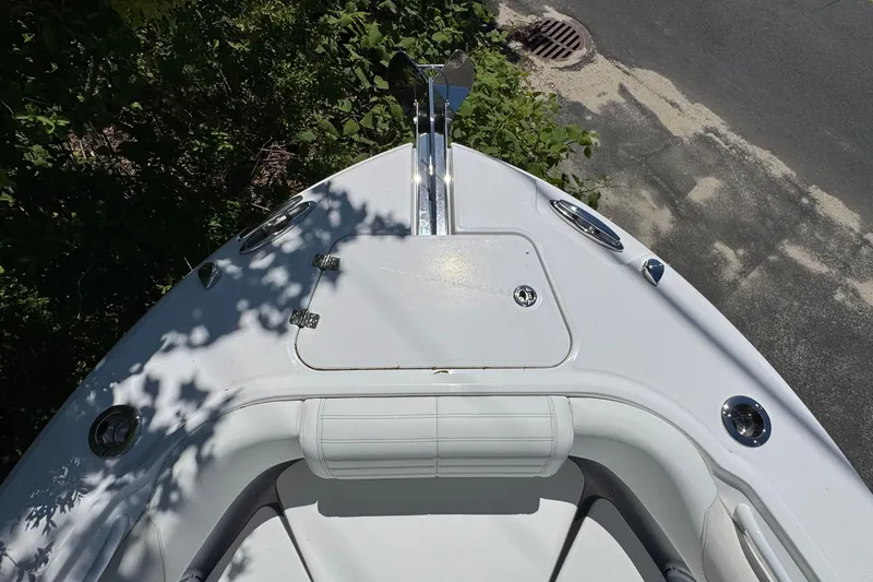 Slide: The Image of Bow view of 2026 Edgewater 262CC boat, featuring sleek design and anchor setup. - 38