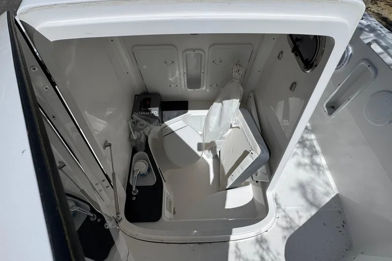 Slide: The Image of Interior of 2026 Edgewater 262CC boat, featuring compact storage and equipment space. - 43