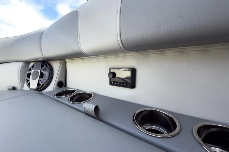 Slide: The Image of 2026 Montara Surf Boss 2.0 SL 23" interior with speaker, control panel, and cup holders. - 10