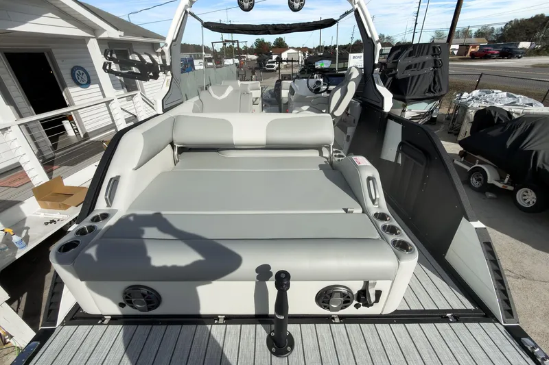 Slide: The Image of 2026 Montara Surf Boss 2.0 SL 23" boat interior with seating and cup holders. - 21