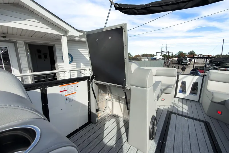 Slide: The Image of 2026 Montara Surf Boss 2.0 SL 23" boat interior with seating and storage. - 28