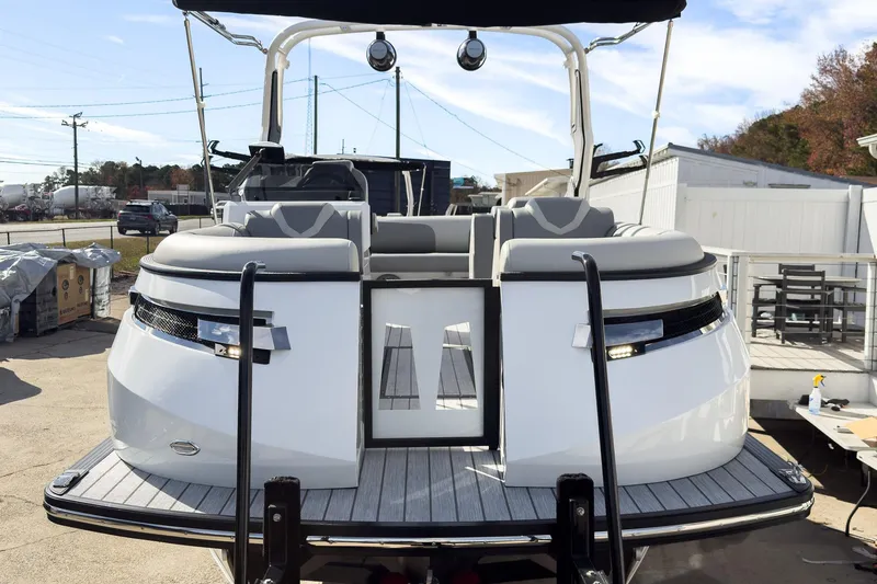 Slide: The Image of 2026 Montara Surf Boss 2.0 SL 23" boat, rear view with seating and sleek design. - 3