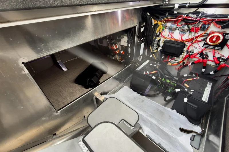 Slide: The Image of Interior view of 2026 Montara Surf Boss 2.0 SL 23" boat wiring and battery setup. - 33