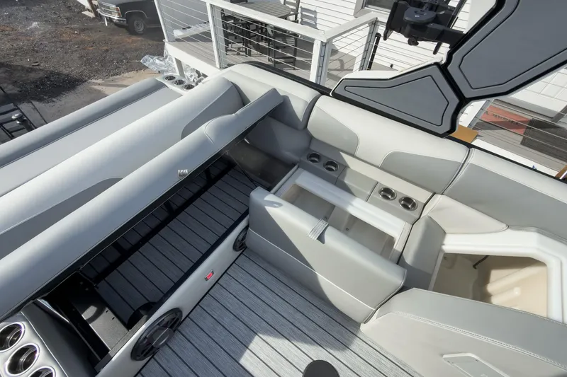 Slide: The Image of 2026 Montara Surf Boss 2.0 SL 23" boat interior with sleek seating and cup holders. - 40