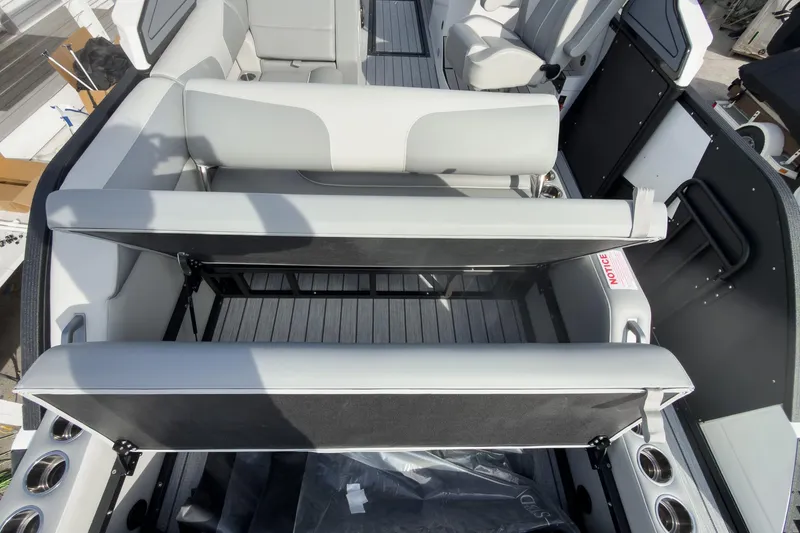 Slide: The Image of 2026 Montara Surf Boss 2.0 SL 23" boat interior with adjustable seating and cup holders. - 41