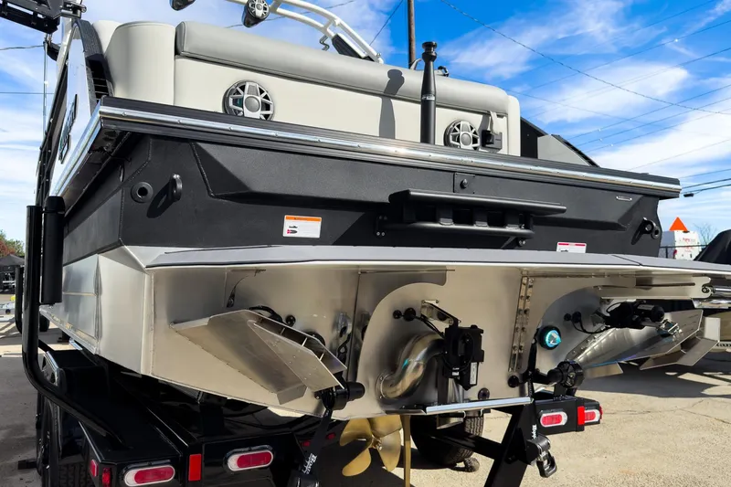 Slide: The Image of 2026 Montara Surf Boss 2.0 SL 23" boat rear view with dual propellers. - 5