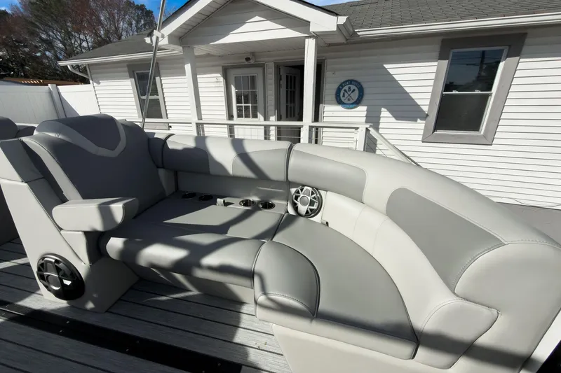 Slide: The Image of 2026 Montara Surf Boss 2.0 SL 23" boat interior with gray seating and cup holders. - 8
