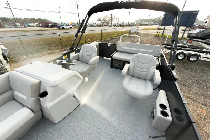 Slide: The Image of 2026 Godfrey Sweetwater Xperience 22' Tritoon interior with plush seating and modern design. - 13