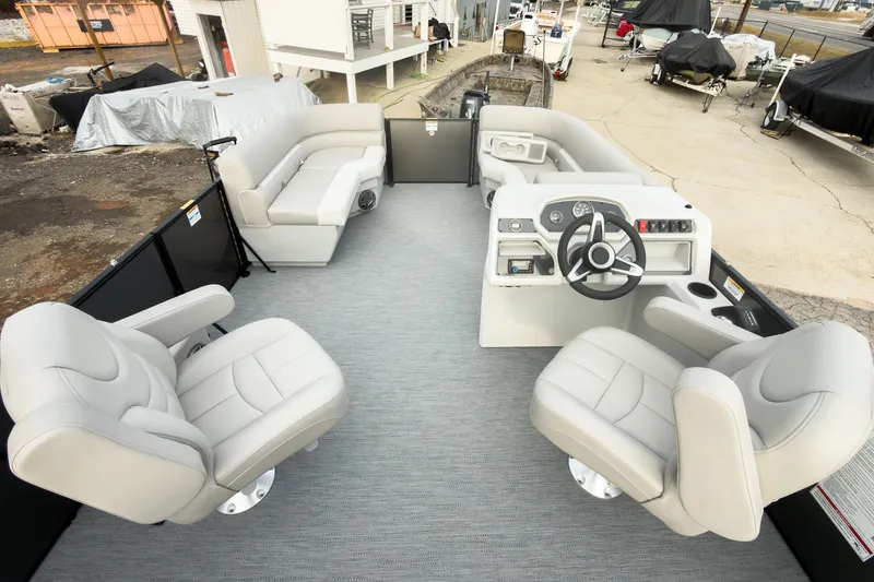 Slide: The Image of 2026 Godfrey Sweetwater Xperience 22' Tritoon interior with plush seating and modern helm. - 29